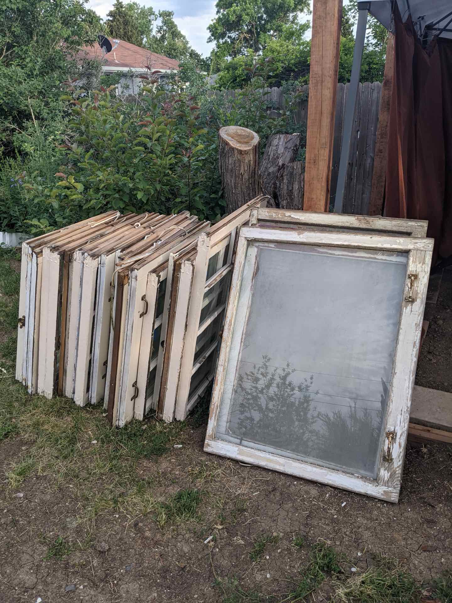 Salvaged windows collected for the shed